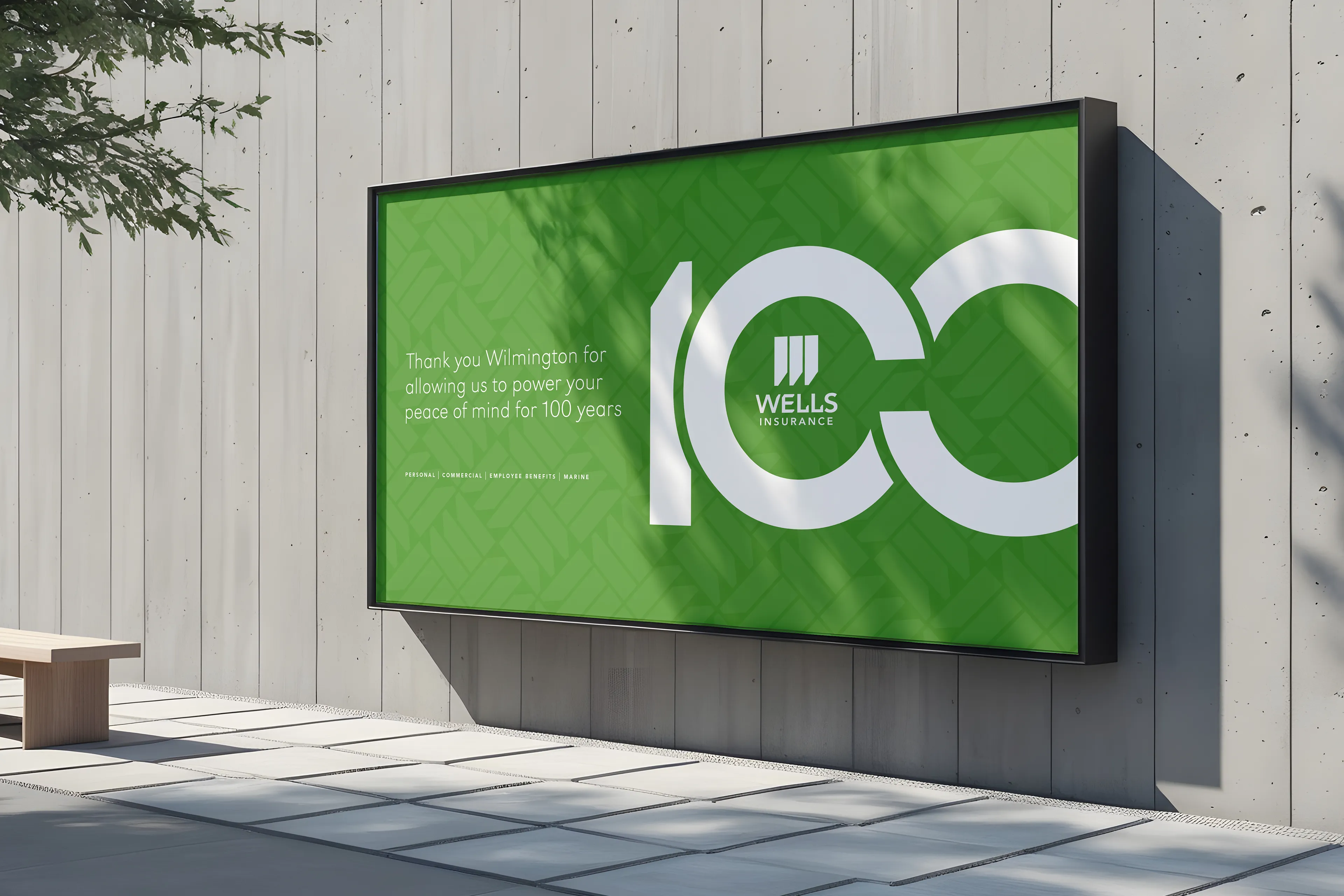 An out-of-home (OOH) print billboard advertising Wells Insurance 