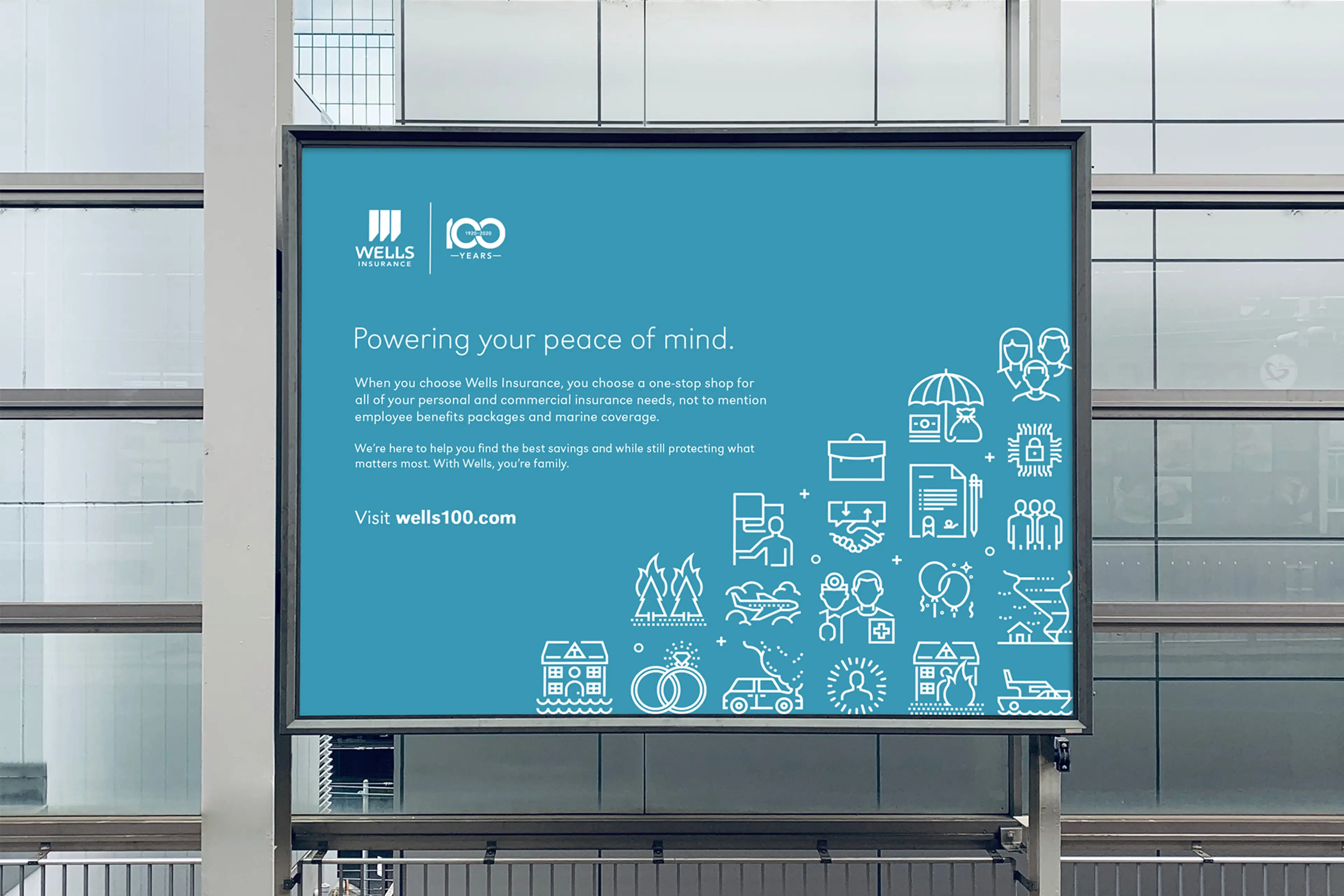 An out-of-home (OOH) print billboard advertising Wells Insurance 